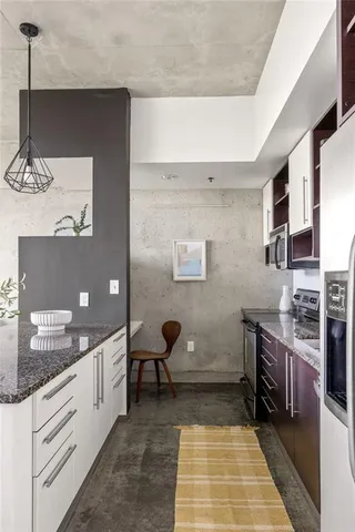 a bathroom with a double vanity sink a toilet and mirror