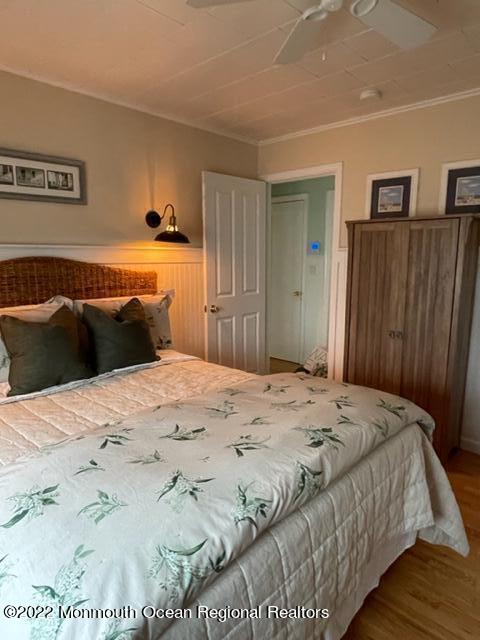 179 4th Avenue Manasquan, NJ 08736 - Photo 11 of 28 a bedroom with a bed and wooden floor