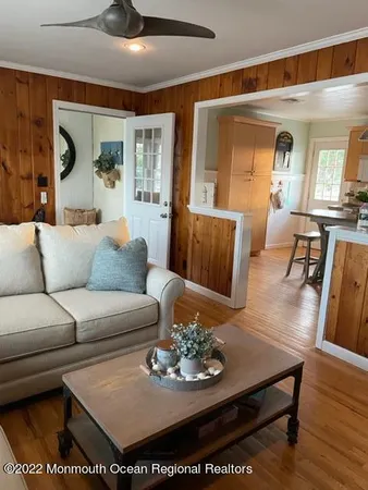 a living room with furniture or couch and a dining table