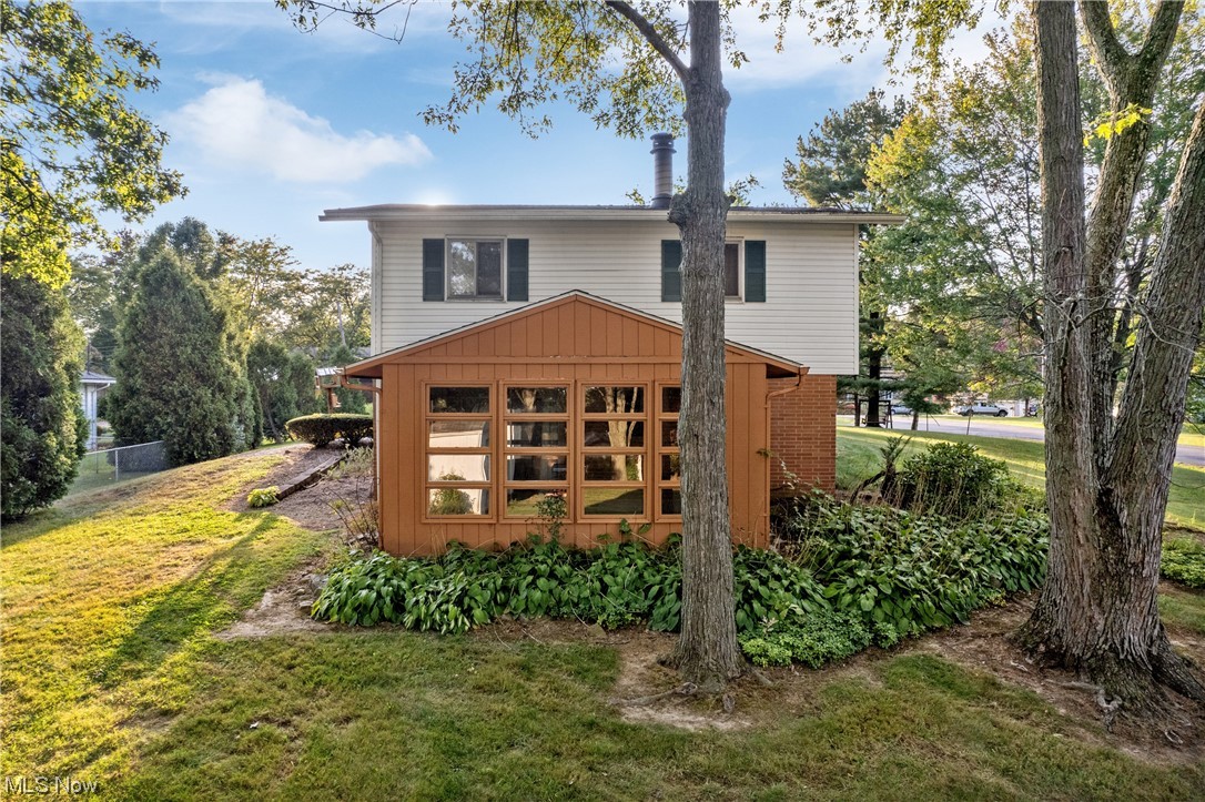 120 Lester Road New Franklin, OH 44319 - Photo 23 of 24 Rear view of property featuring a lawn