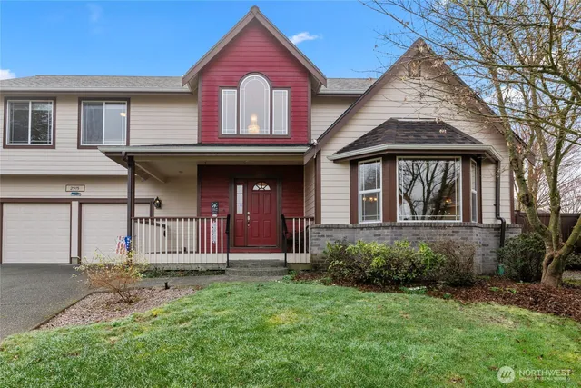 a front view of a house with a garden