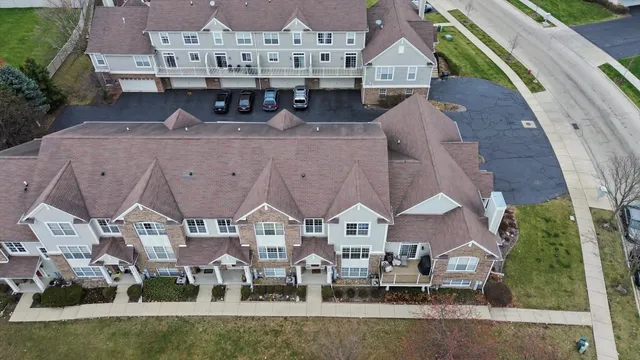 an aerial view of a residential houses with outdoor space