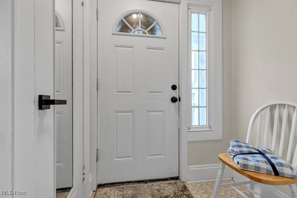 2127 Rossmoor Road Cleveland Heights, OH 44118 - Photo 2 of 21 Foyer entrance featuring baseboards and tile patterned flooring