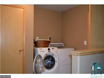 274 Freeman Road Cloquet, MN 55720 - Photo 5 of 21 Large laundry area off kitchen from attached garage.