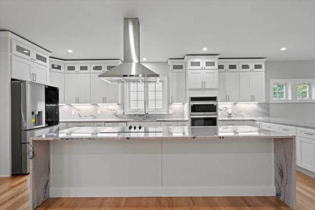 241 Lake Avenue Worcester, MA 01604 - Photo 13 of 42 a kitchen with kitchen island granite countertop a sink stainless steel appliances and cabinets