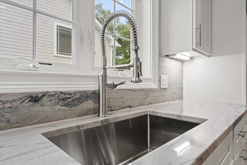 241 Lake Avenue Worcester, MA 01604 - Photo 16 of 42 a view of a kitchen that has a sink and a window