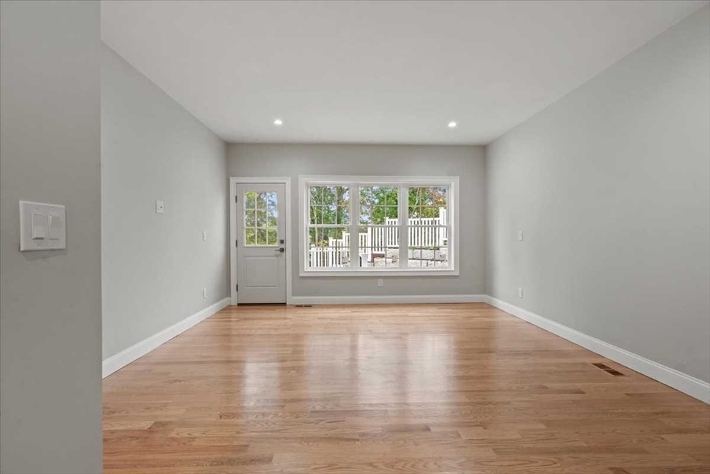 241 Lake Avenue Worcester, MA 01604 - Photo 20 of 42 a view of an empty room with wooden floor and a window