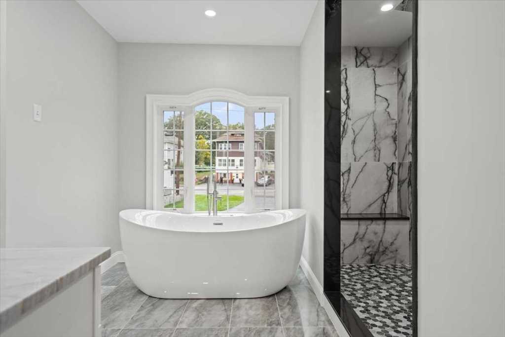 241 Lake Avenue Worcester, MA 01604 - Photo 22 of 42 a white bath tub sitting in a bathroom