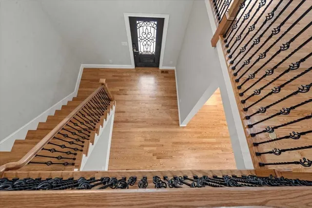 a view of an entryway with wooden floor