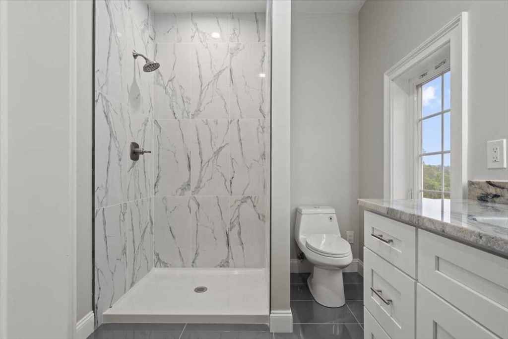 241 Lake Avenue Worcester, MA 01604 - Photo 29 of 42 a bathroom with a granite countertop sink a toilet and shower