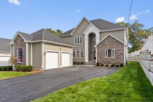 a front view of a house with a yard