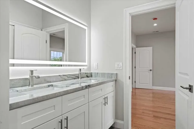a bathroom with a sink and a mirror