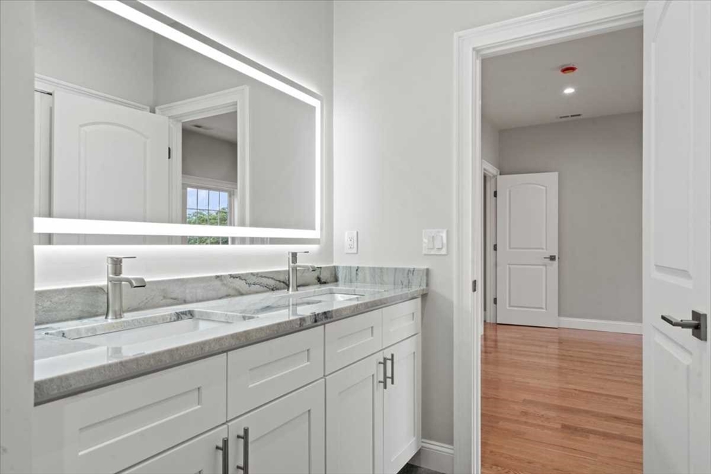 241 Lake Avenue Worcester, MA 01604 - Photo 33 of 42 a bathroom with a sink and a mirror