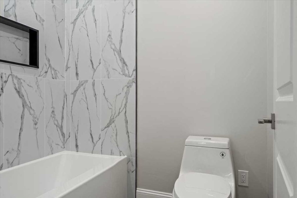 241 Lake Avenue Worcester, MA 01604 - Photo 34 of 42 a white toilet sitting next to a white tub