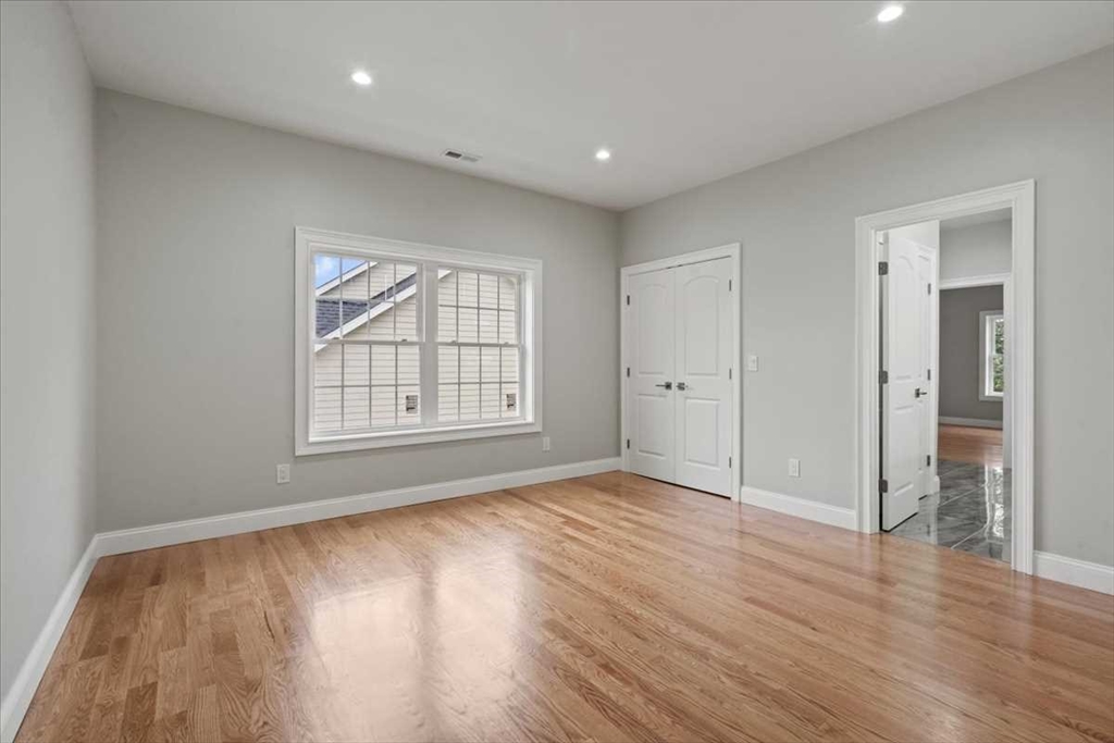 241 Lake Avenue Worcester, MA 01604 - Photo 35 of 42 a view of an empty room with wooden floor and a window