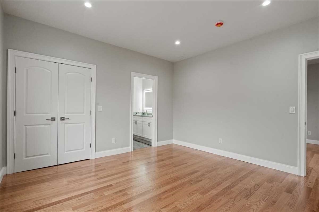 241 Lake Avenue Worcester, MA 01604 - Photo 36 of 42 a view of an empty room with wooden floor