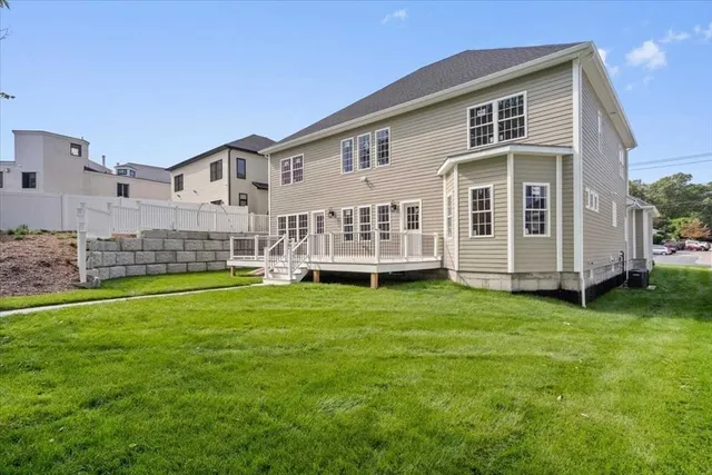 a view of a house with a backyard