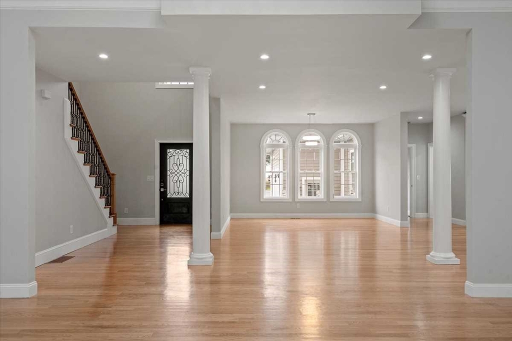 241 Lake Avenue Worcester, MA 01604 - Photo 8 of 42 a view of an empty room with wooden floor and a window