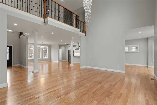 a view of an entryway with wooden floor