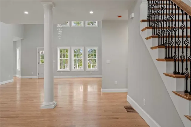 a view of an entryway with wooden floor