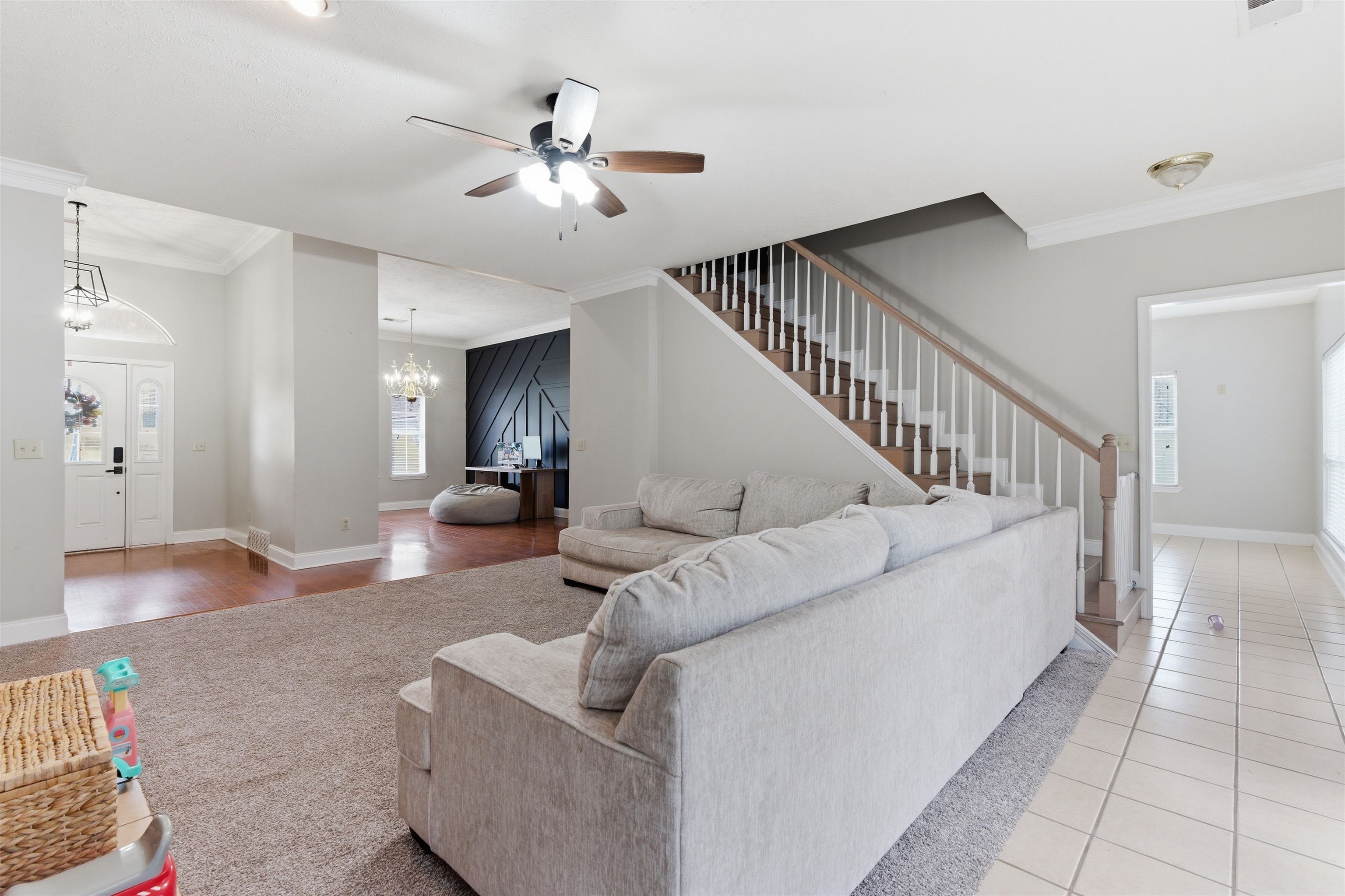 915 Cliffview Road Bolivar, TN 38008 - Photo 8 of 35 Living room with suspended lighting, ornamental molding, and a ceiling fan