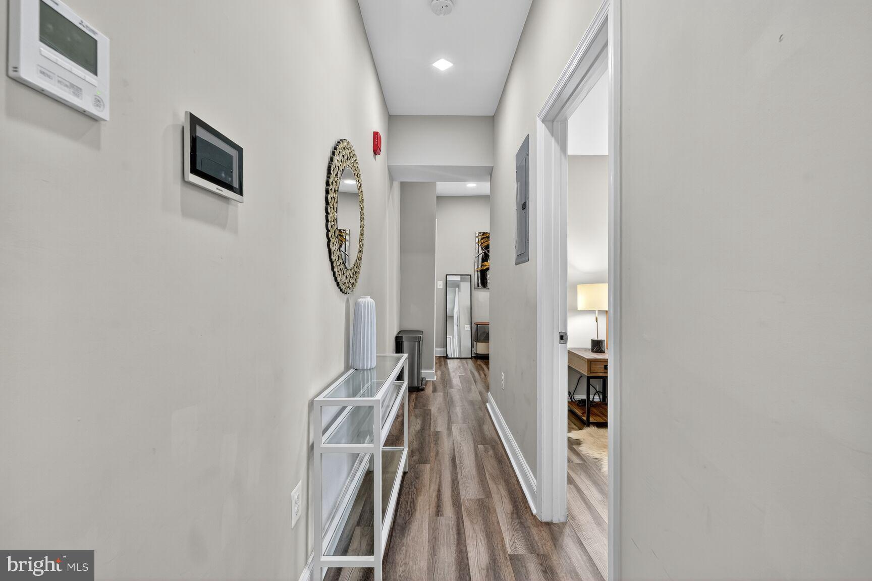 133 7th Street Southeast, Unit 1 Washington, DC 20003 - Photo 4 of 13 a view of a hallway with wooden floor and entryway