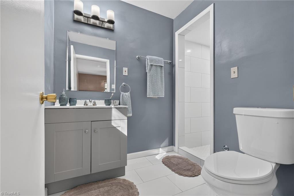 113 Green Valley Road Greensboro, NC 27403 - Photo 26 of 46 Thoughtfully updated finishes create a primary bathroom that's both fresh and timeless.