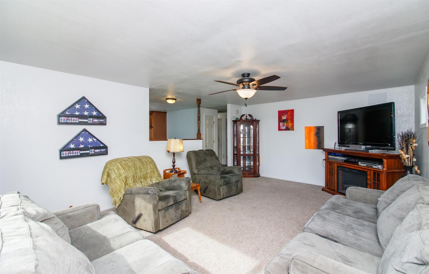 480 Elm Way Eagle Point, OR 97524 - Photo 10 of 26 a living room with furniture and a flat screen tv