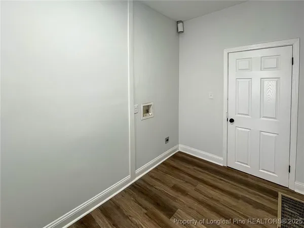 a view of a room with wooden floor and closet