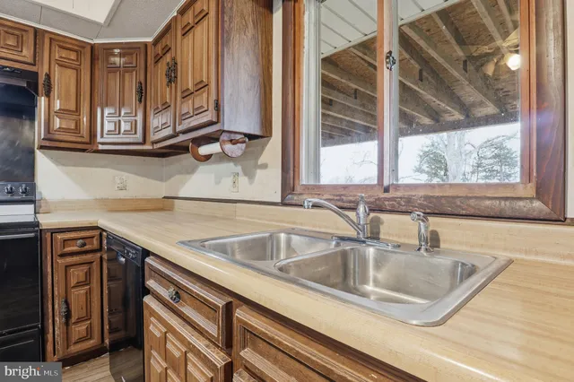 a view white cabinets and a sink