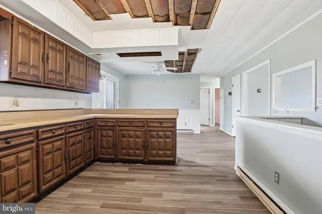a kitchen with stainless steel appliances granite countertop a sink and cabinets