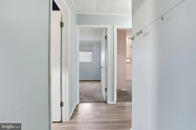 a view of a bathroom from a hallway