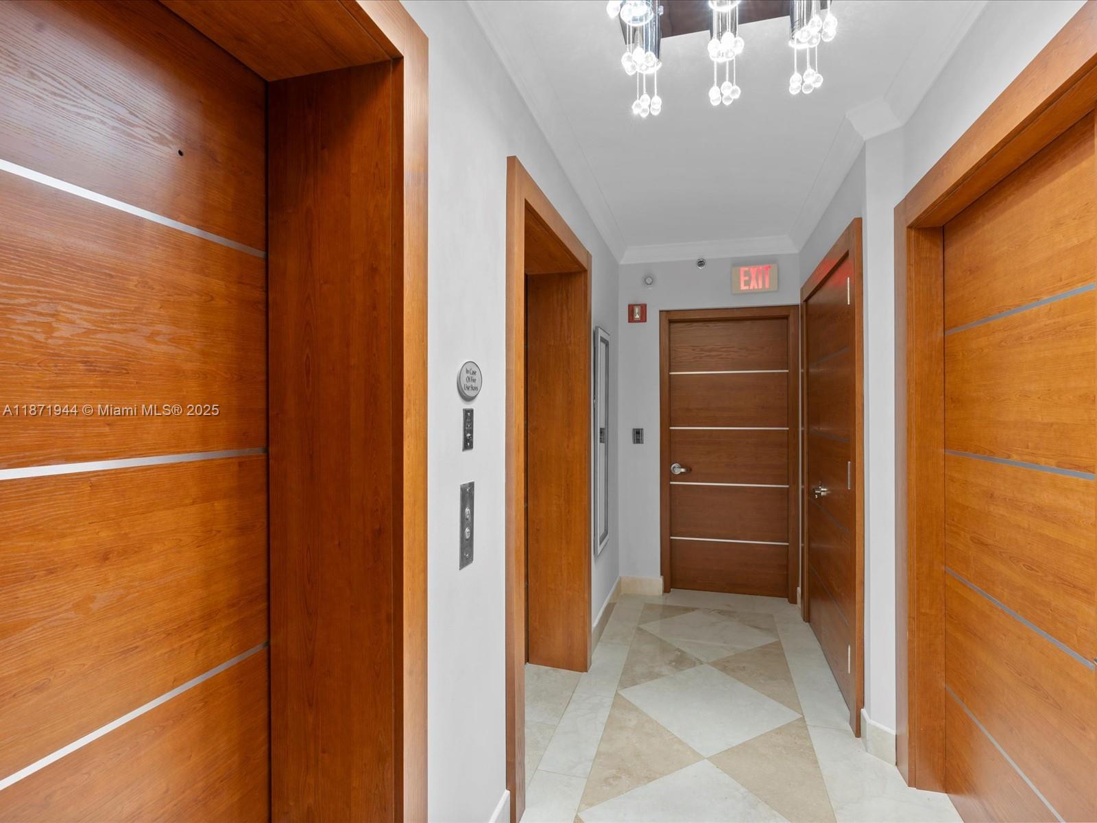 19111 Collins Avenue, Unit 1406 Sunny Isles Beach, FL 33160 - Photo 35 of 40 a view of an empty room with a fireplace