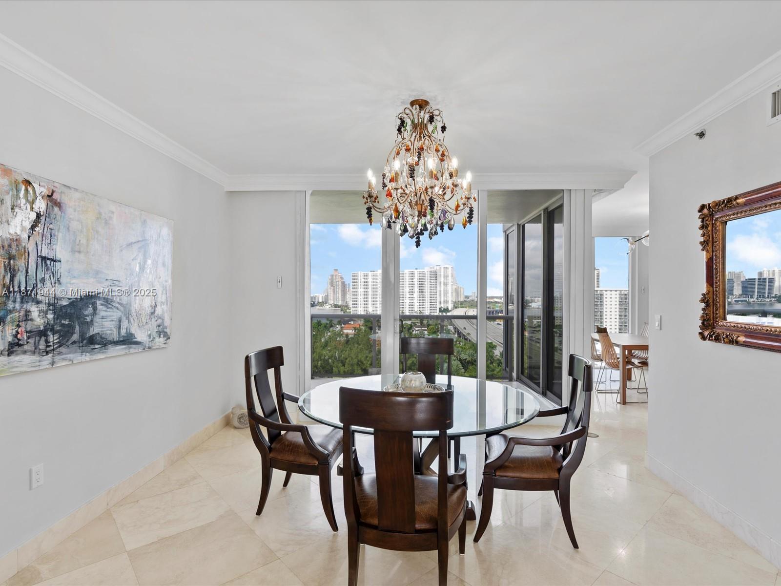 19111 Collins Avenue, Unit 1406 Sunny Isles Beach, FL 33160 - Photo 9 of 40 a view of a dining room with furniture window and outside view