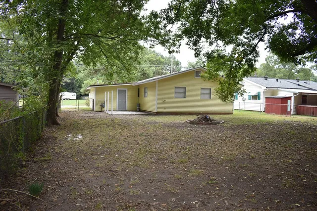 a house with trees in the background