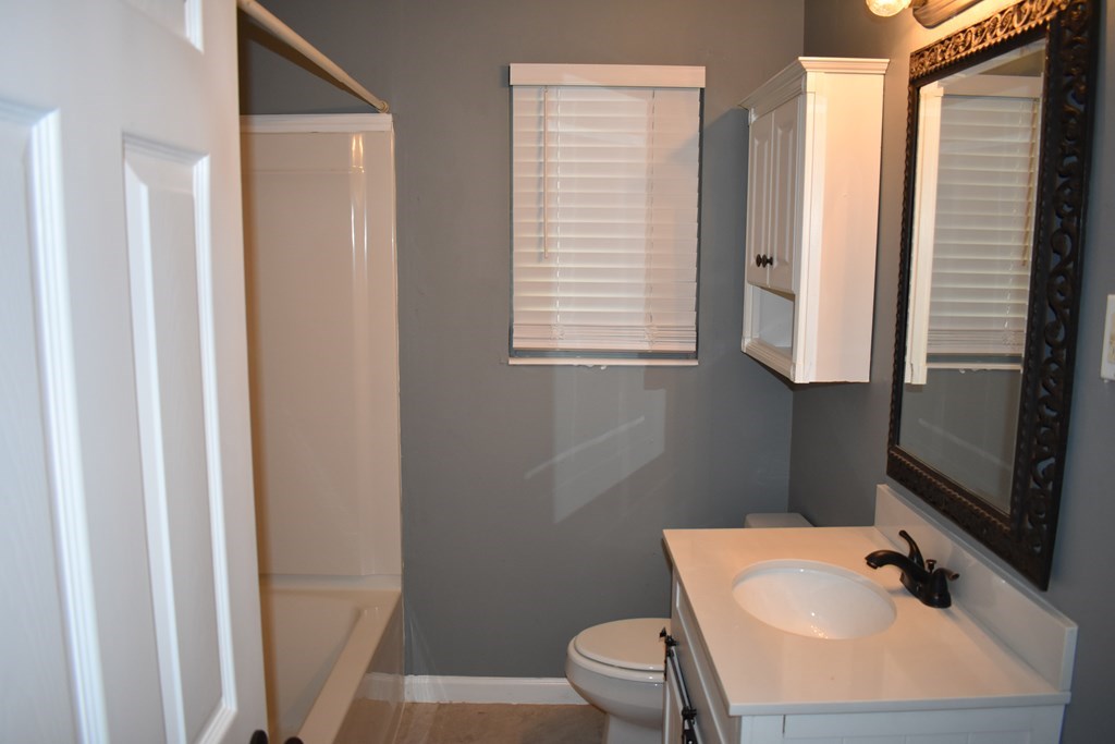 2127 Lamore Drive Columbus, GA 31907 - Photo 7 of 8 a bathroom with a sink toilet and mirror