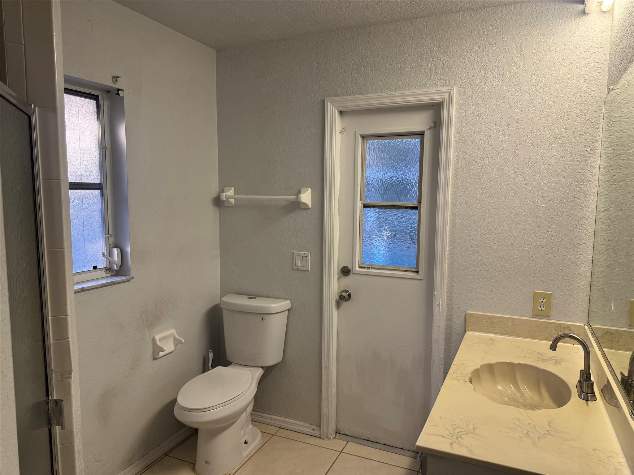 529 Guild Street Port Charlotte, FL 33954 - Photo 13 of 41 a bathroom with a sink toilet and vanity