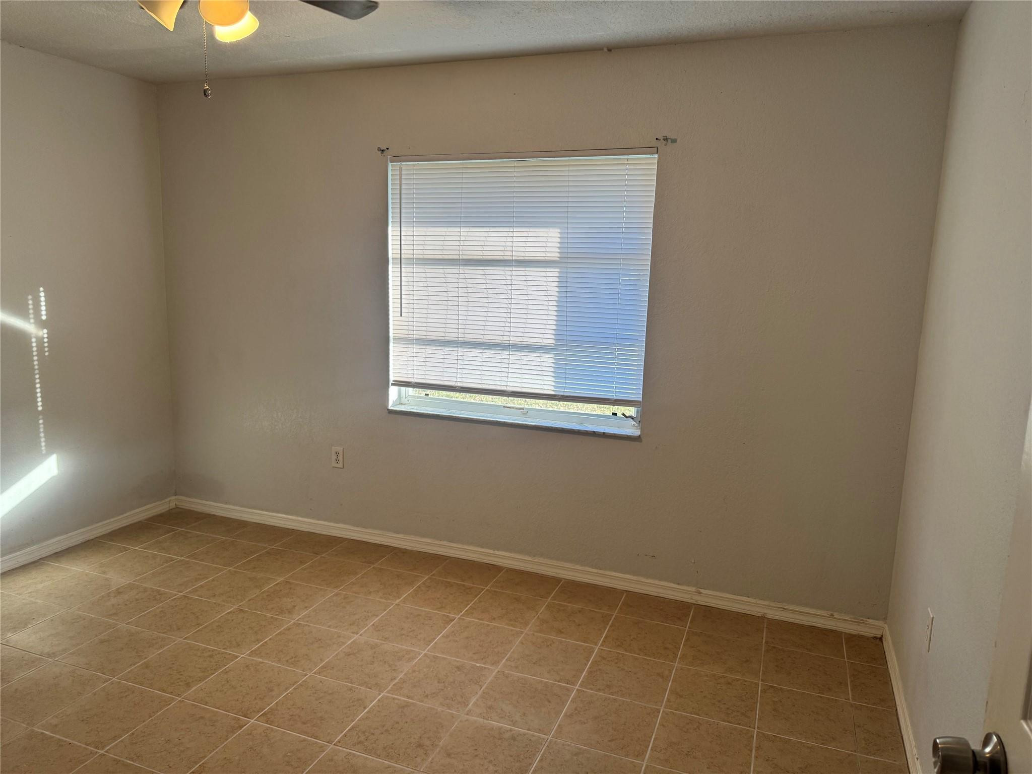 529 Guild Street Port Charlotte, FL 33954 - Photo 14 of 41 an empty room with a window
