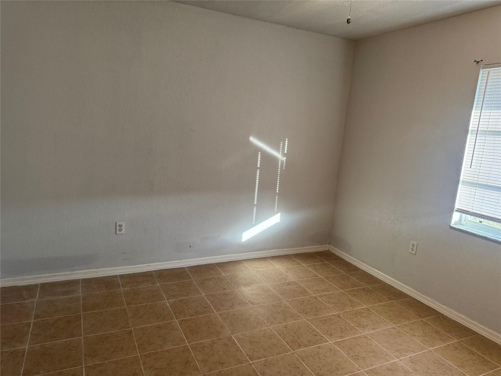 529 Guild Street Port Charlotte, FL 33954 - Photo 15 of 41 a view of an empty room and a window