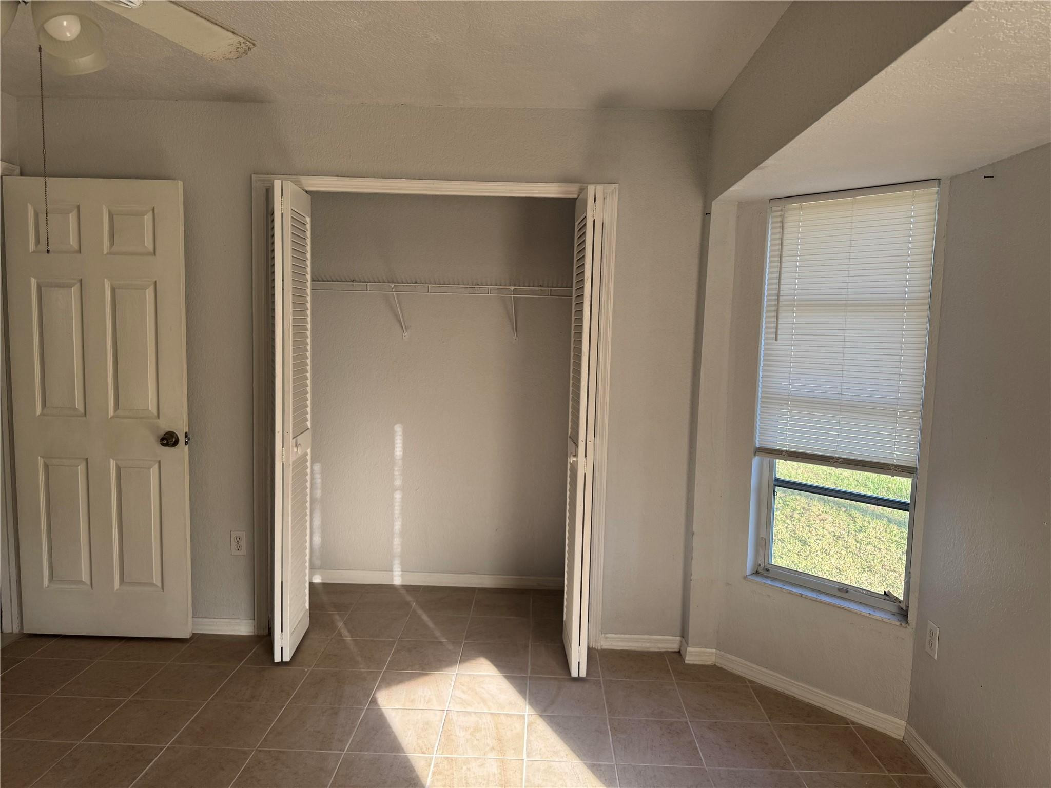 529 Guild Street Port Charlotte, FL 33954 - Photo 10 of 41 an empty room with windows and closet