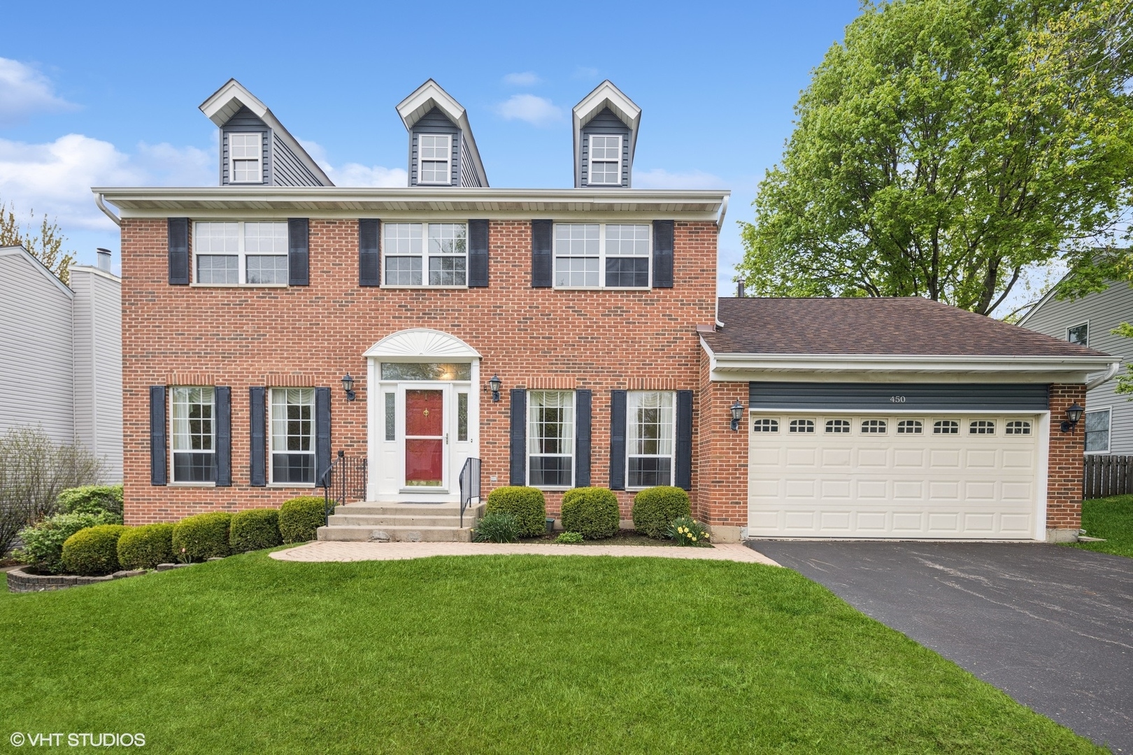 450 Old Oak Circle Algonquin, IL 60102 - Photo 1 of 1 a front view of a house with a yard and garage