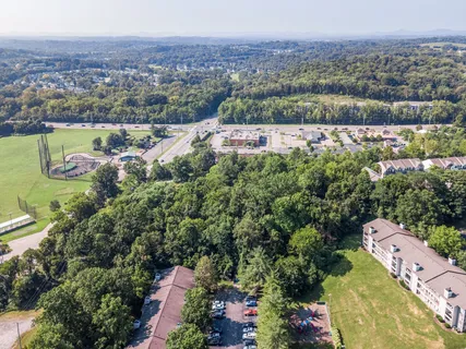 an aerial view of a house with a garden