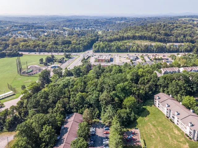 an aerial view of a house with a garden