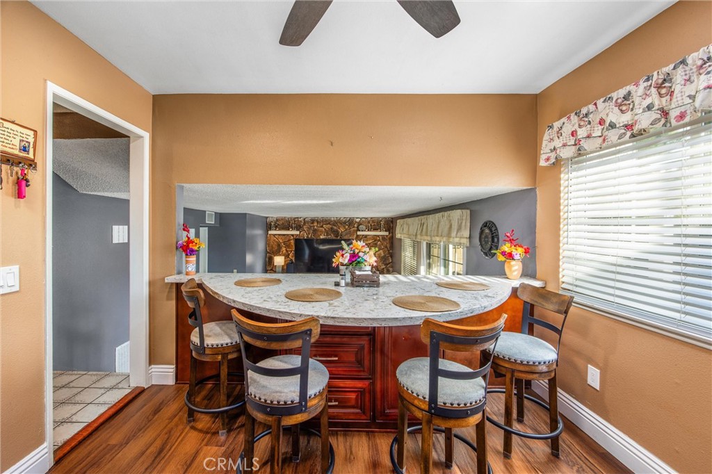 10399 Monte Vista Street Rancho Cucamonga, CA 91701 - Photo 17 of 43 a view of a dining room with furniture and wooden floor