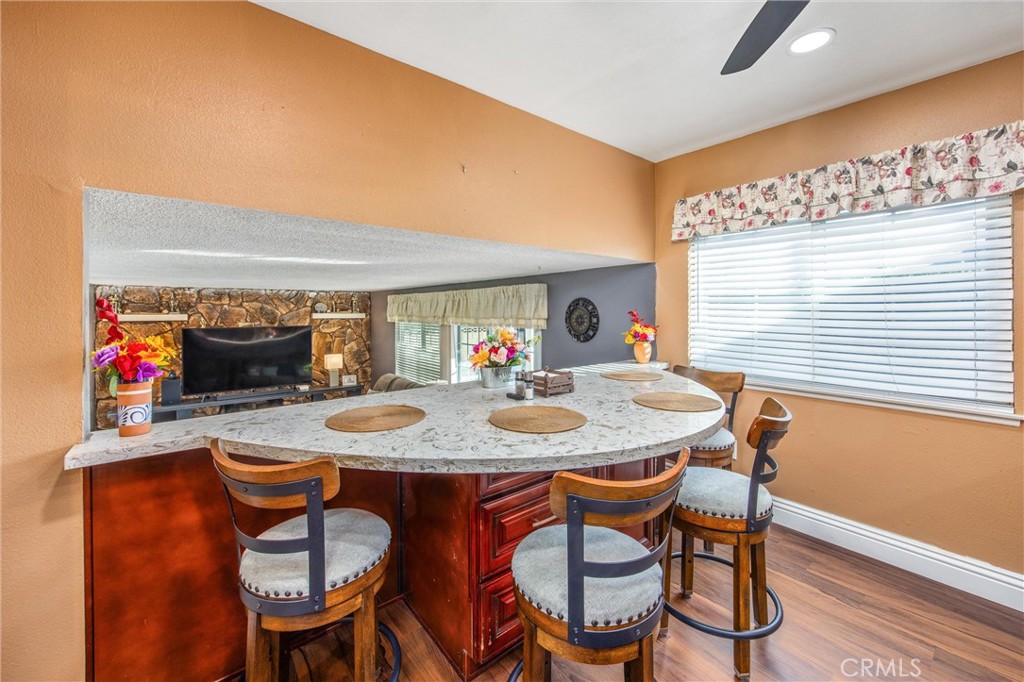 10399 Monte Vista Street Rancho Cucamonga, CA 91701 - Photo 19 of 43 a dining room with furniture and wooden floor