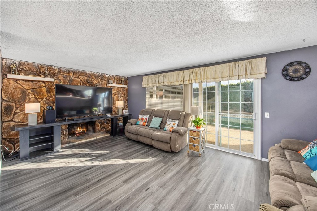 10399 Monte Vista Street Rancho Cucamonga, CA 91701 - Photo 20 of 43 a living room with furniture and a flat screen tv