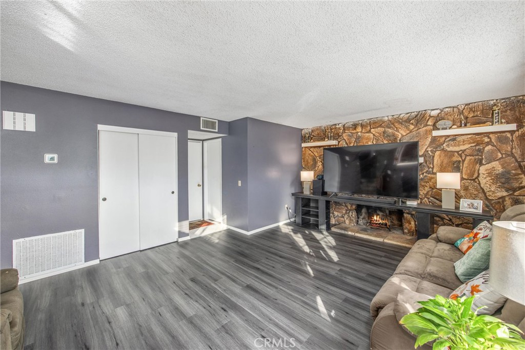 10399 Monte Vista Street Rancho Cucamonga, CA 91701 - Photo 21 of 43 a living room with furniture and a flat screen tv