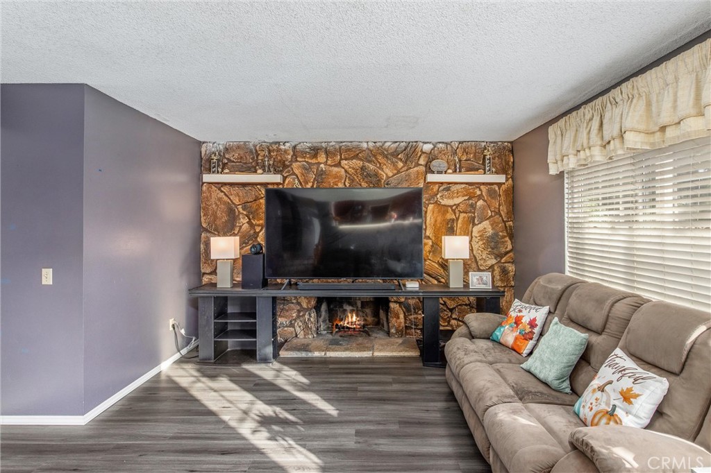 10399 Monte Vista Street Rancho Cucamonga, CA 91701 - Photo 24 of 43 a living room with furniture and a flat screen tv