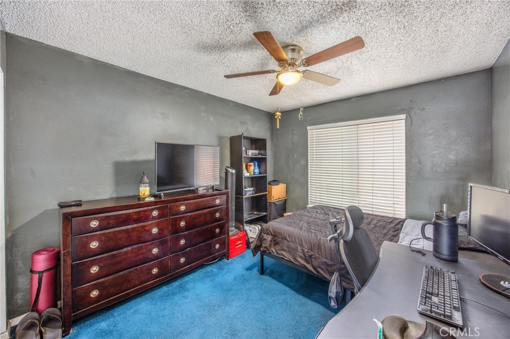 10399 Monte Vista Street Rancho Cucamonga, CA 91701 - Photo 28 of 43 a living room with furniture and a flat screen tv