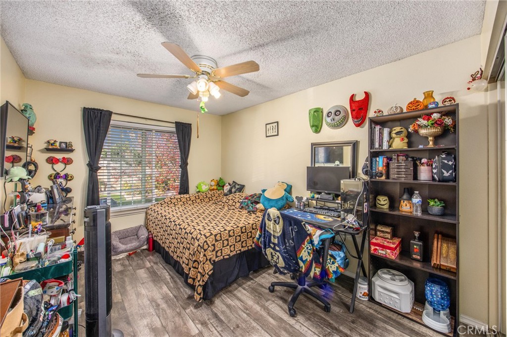 10399 Monte Vista Street Rancho Cucamonga, CA 91701 - Photo 29 of 43 a bed room with a bed and a book shelf
